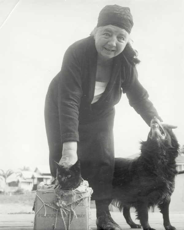 Elderly Woman With Cat and Dog 