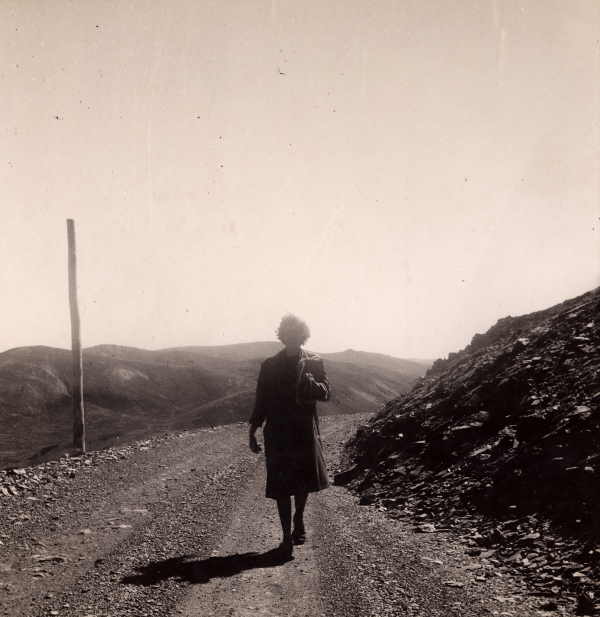 Woman Walking Near Summit